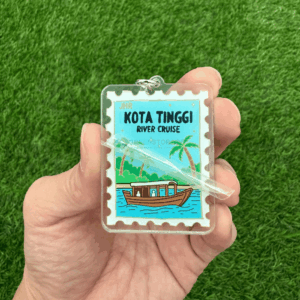 Peeling off protective film from acrylic keychain to reveal scratch-free surface